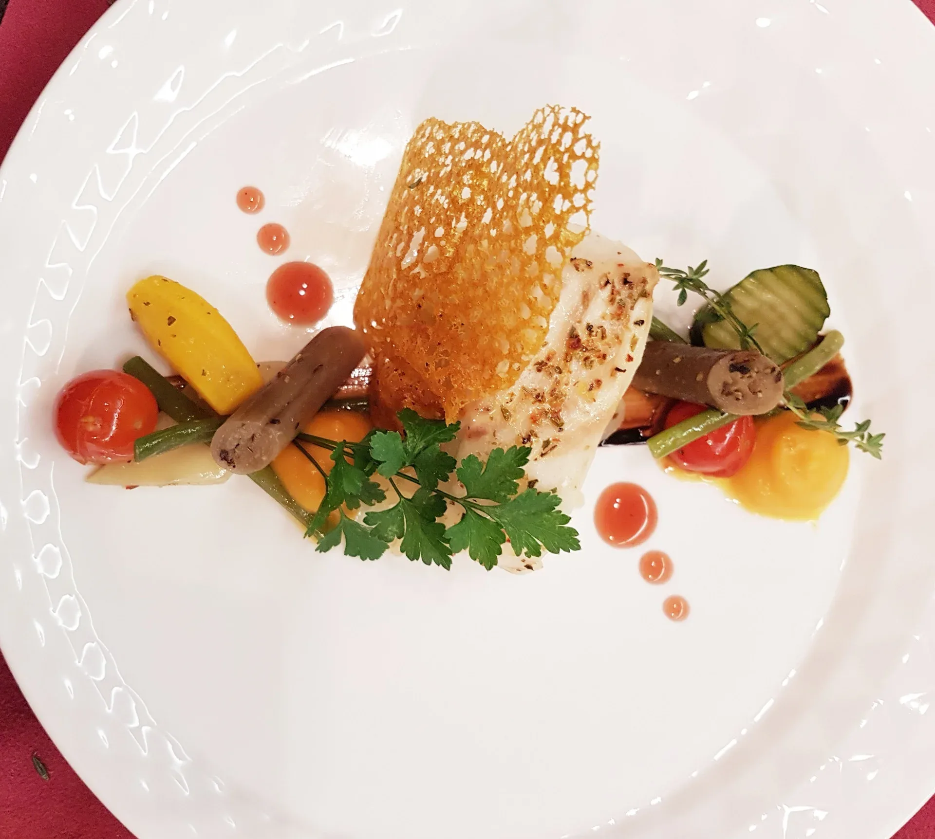Elegantly plated gourmet dish with artistic presentation reflecting the refined culinary excellence offered at Rêves Gourmands.
